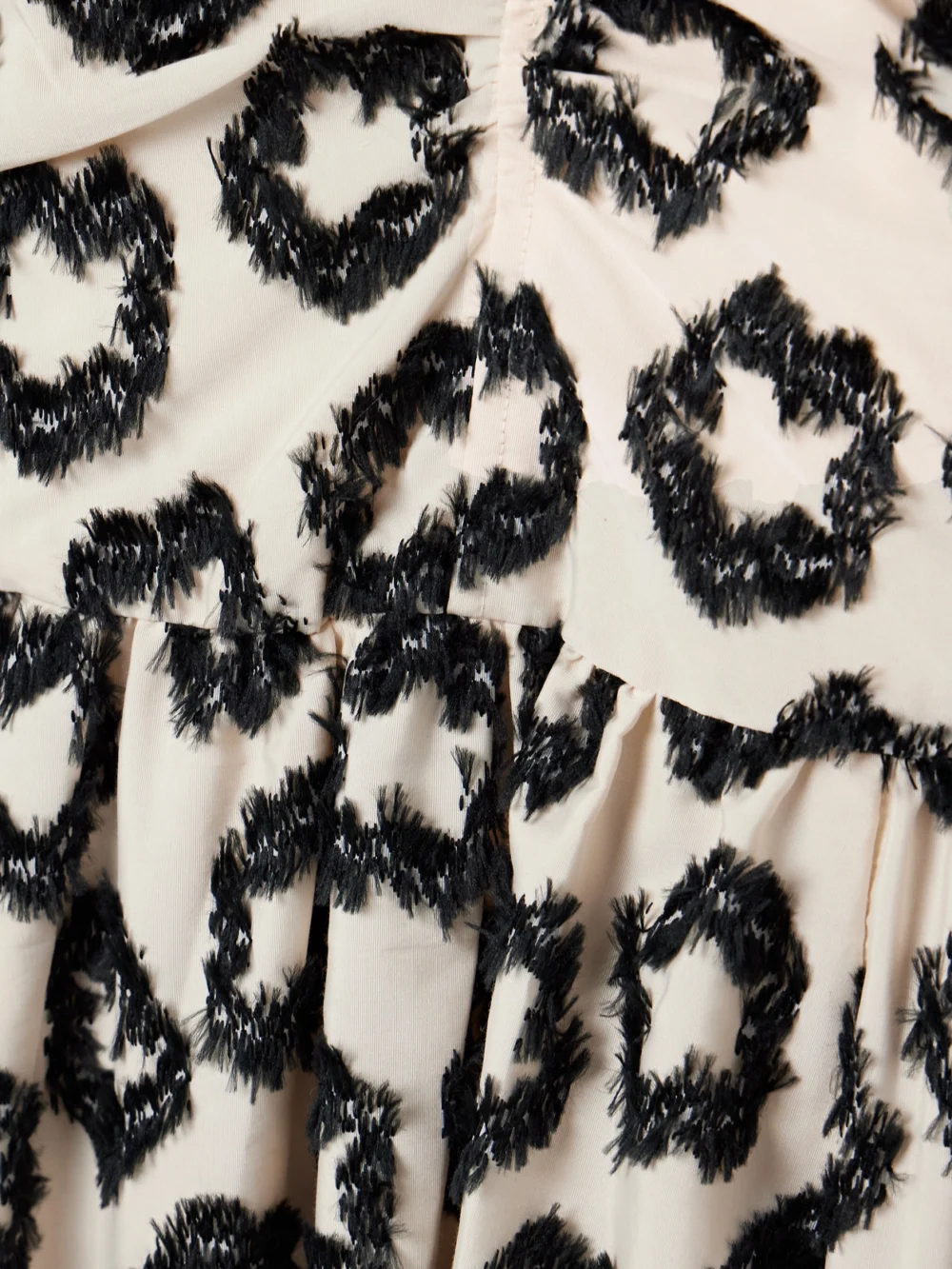 Close-up detail of the Ulla Johnson Violeta Chiffon-trimmed Ruched Fil Coupé Recycled-faille Midi Dress