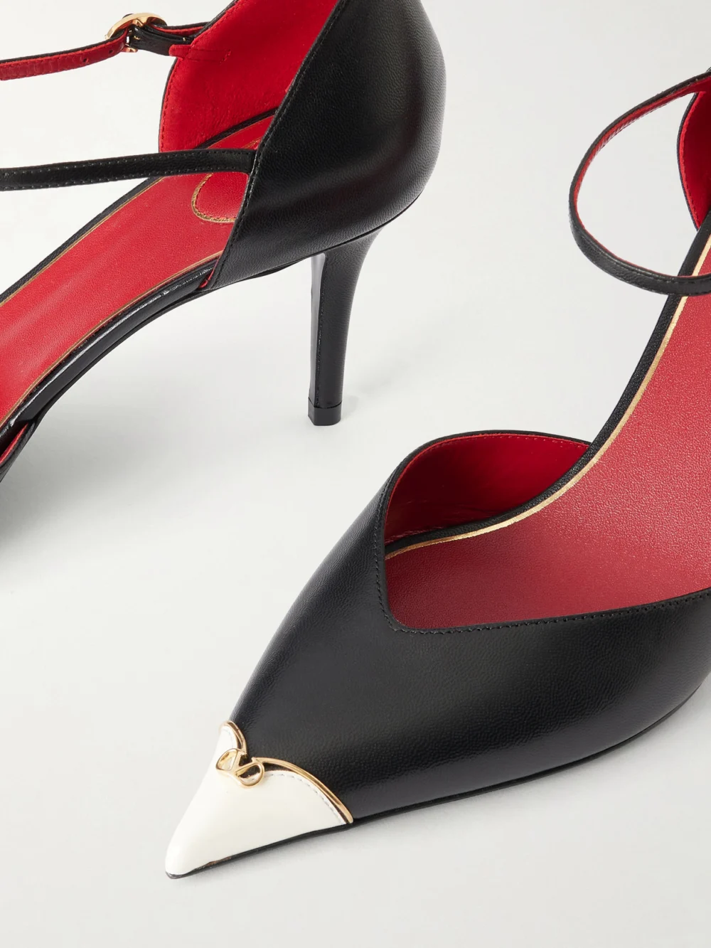 Close-up detail of the Valentino Garavani 75 Logo-embellished Leather Pumps