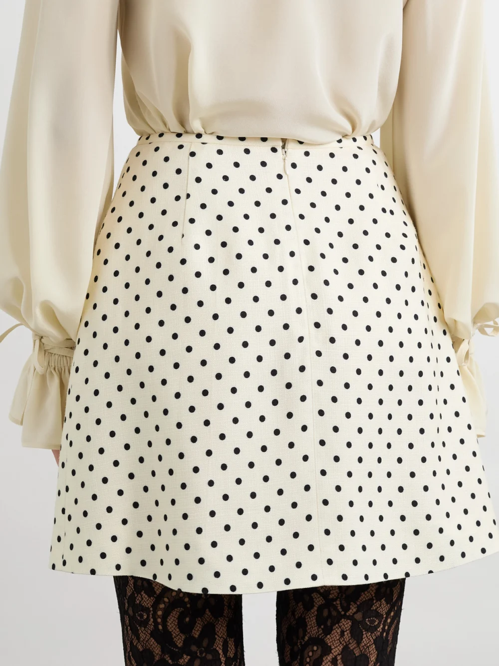 Back view of the Valentino Garavani Aline Polka-dot Canvas Mini Skirt