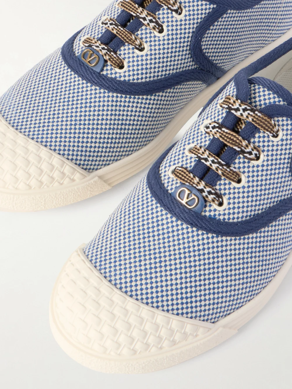 Close-up detail of the Valentino Garavani Bay By Bay Rubber-trimmed Two-tone Canvas Sneakers