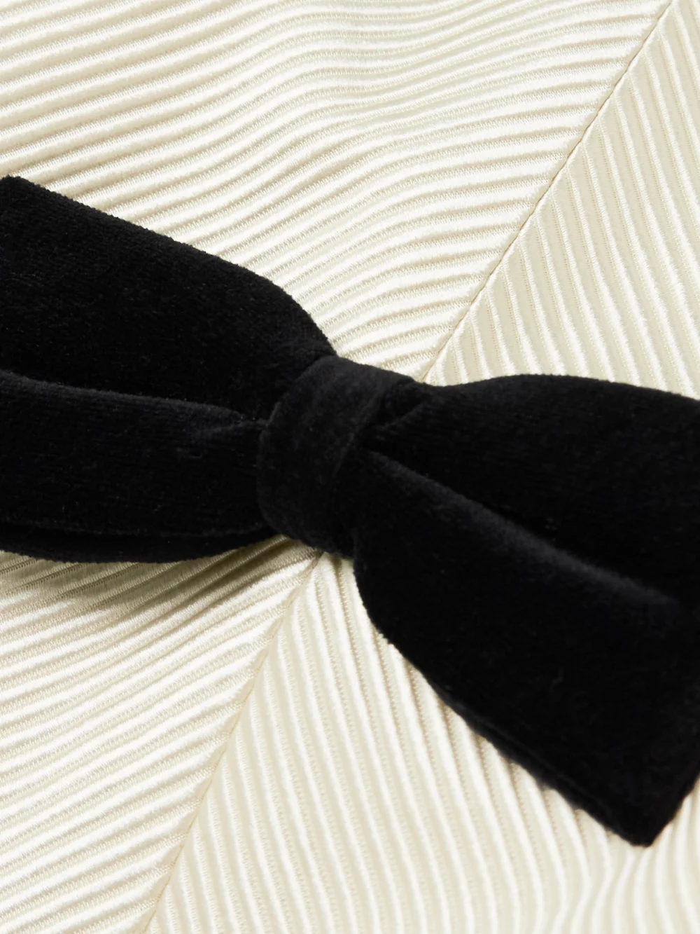 Close-up detail of the Valentino Garavani Belted Bow-embellished Velvet and Ottoman-trimmed Wool Midi Dress