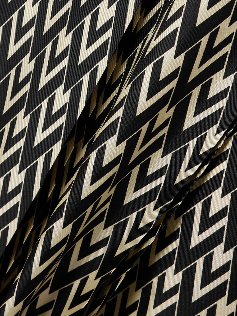 Close-up detail of the Valentino Garavani Belted Pleated Printed Silk-twill Midi Skirt