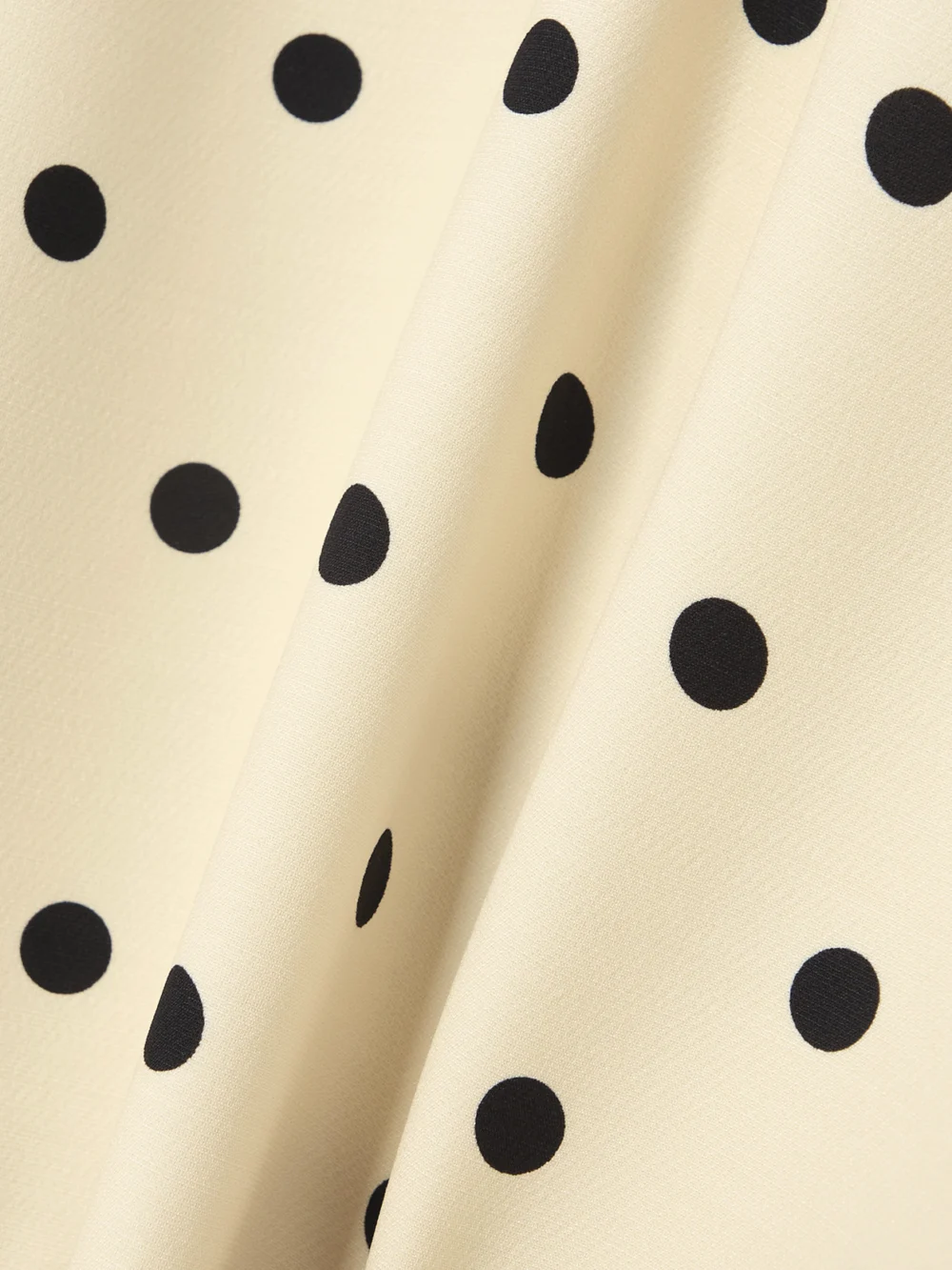 Close-up detail of the Valentino Garavani Belted Ruffled Polka-dot Wool and Silk-blend Mini Dress