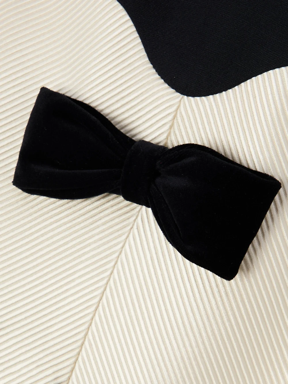 Close-up detail of the Valentino Garavani Bow-detailed Velvet and Ribbed Satin-trimmed Wool and Silk-blend Mini Dress