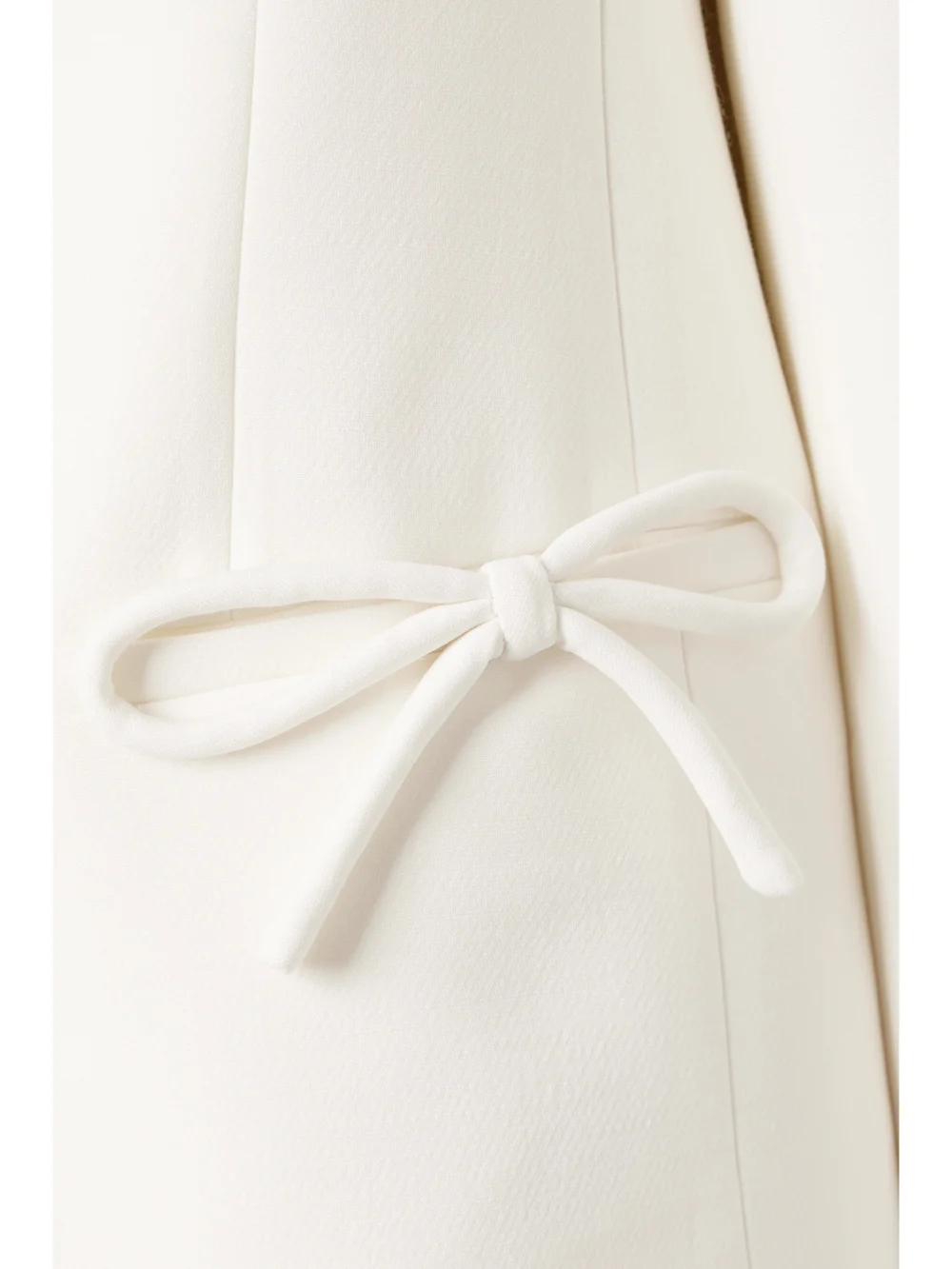 Close-up detail of the Valentino Garavani Bow-detailed Wool and Silk-blend Crepe Jacket