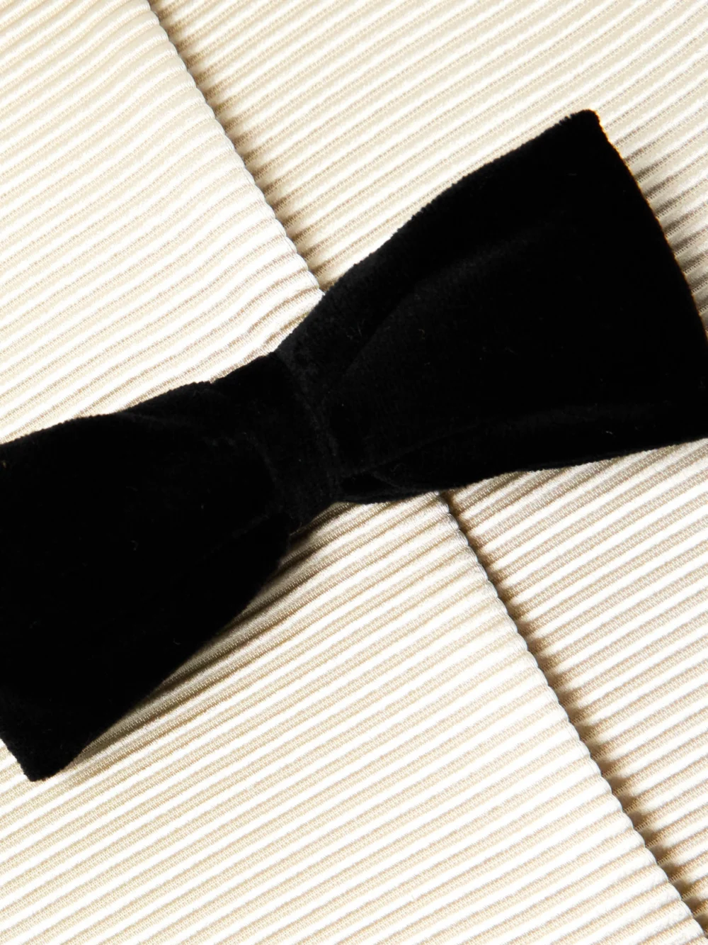 Close-up detail of the Valentino Garavani Bow-embellished Ribbed Cotton-blend and Wool and Silk-blend Crepe Jacket