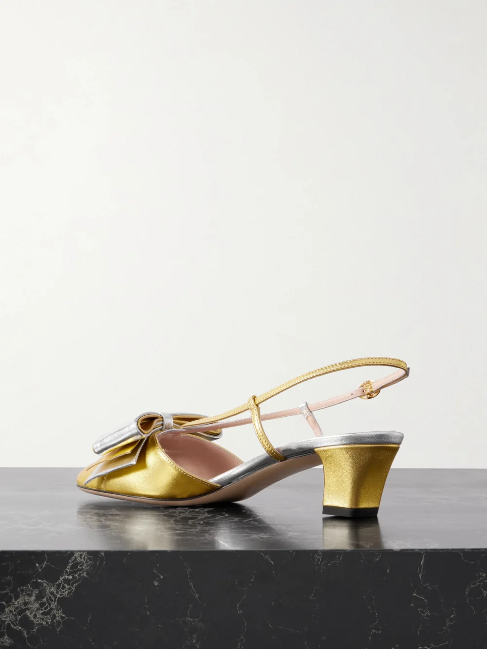 Back view of the Valentino Garavani Bowbow Two-tone Metallic Leather Pumps