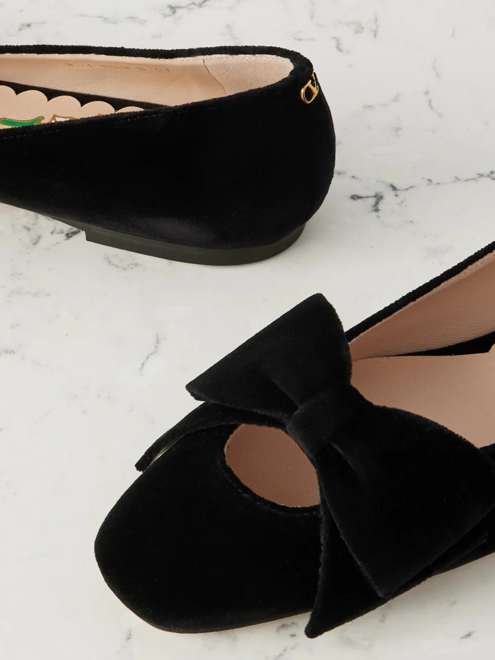 Close-up detail of the Valentino Garavani Bowow Cutout Velvet Ballet Flats