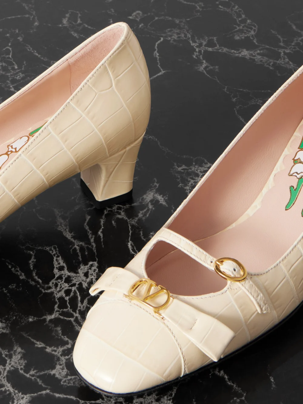 Close-up detail of the Valentino Garavani Bowow Décolleté 45 Embellished Croc-effect Leather Pumps