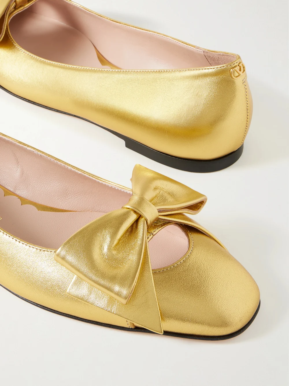 Close-up detail of the Valentino Garavani Bowow Metallic Leather Ballet Flats