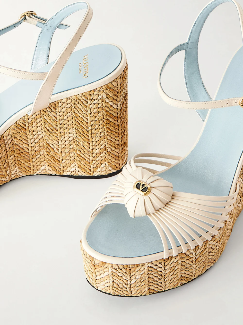 Close-up detail of the Valentino Garavani Coeur Royal 40 Embellished Leather Wedge Espadrilles