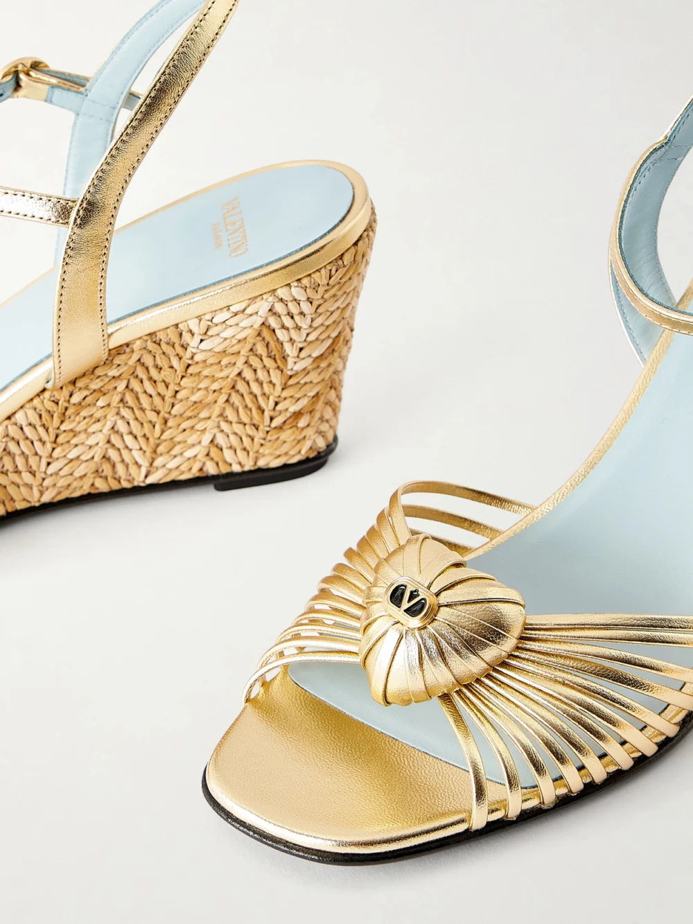 Close-up detail of the Valentino Garavani Coeur Royal 70 Embellished Leather Wedge Sandals
