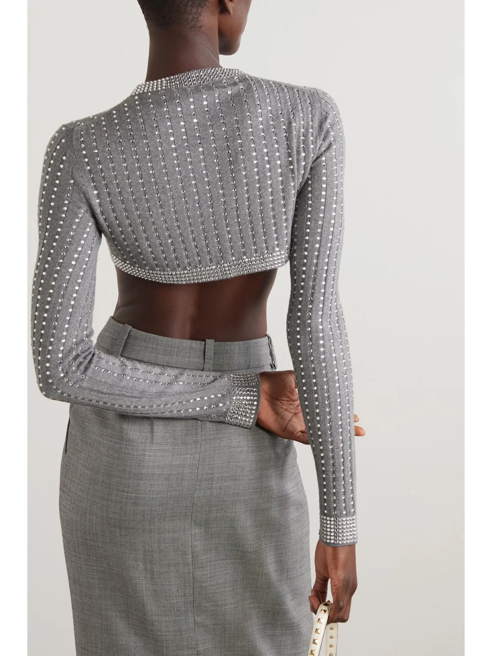 Back view of the Valentino Garavani Cropped Crystal-embellished Ribbed Wool Cardigan