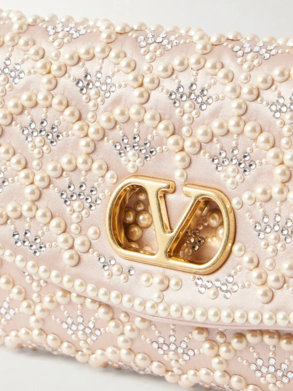 Close-up detail of the Valentino Garavani Devain Pearl and Crystal-embellished Satin Shoulder Bag