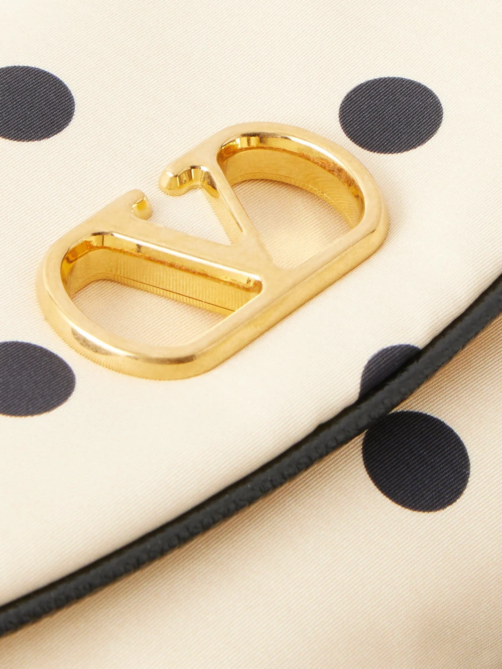 Close-up detail of the Valentino Garavani Devain Polka-dot Moire Clutch