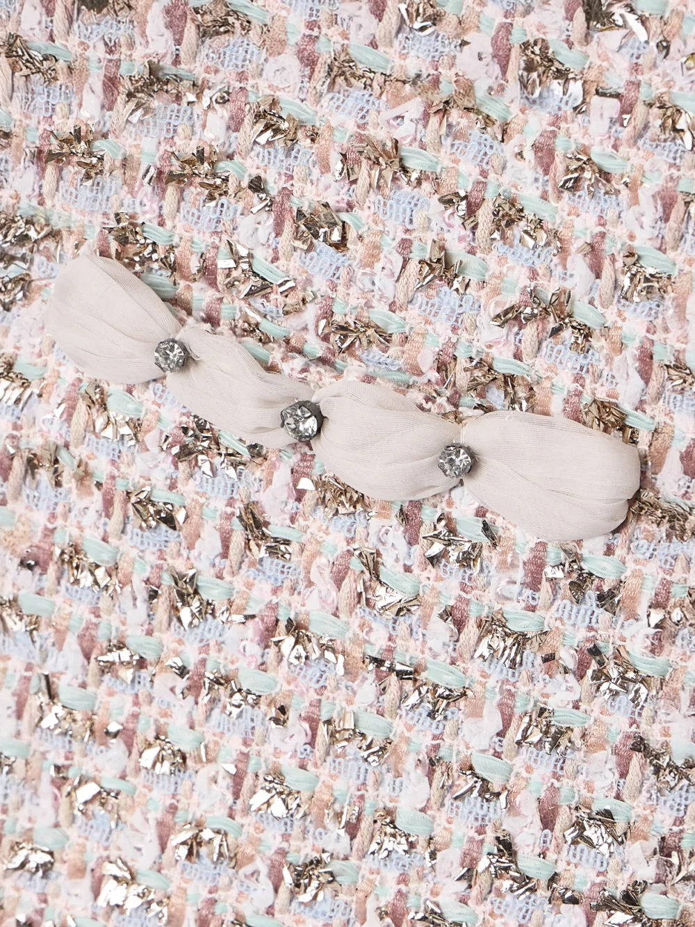 Close-up detail of the Valentino Garavani Embellished Metallic Tweed Mini Skirt