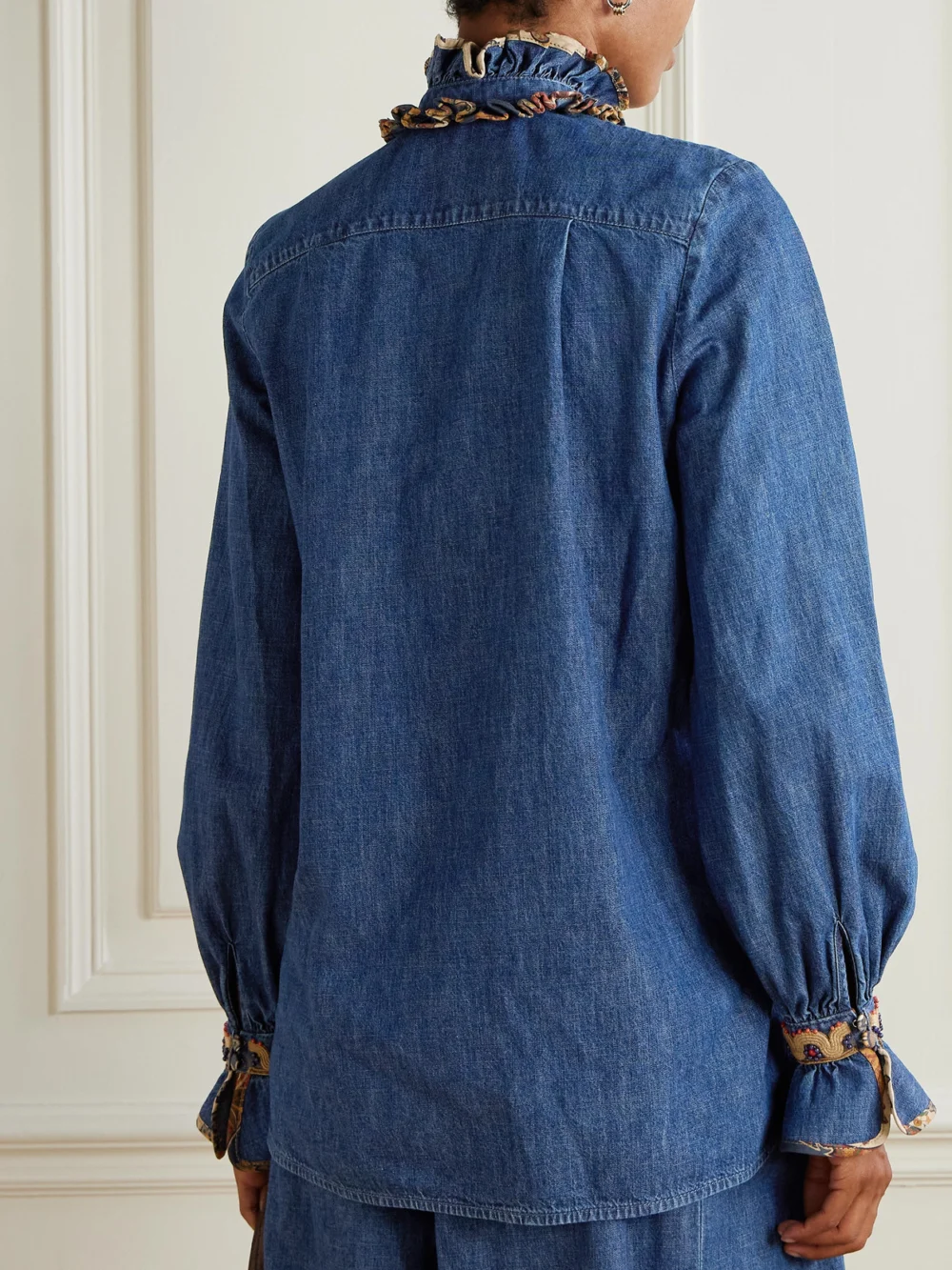 Back view of the Valentino Garavani Embroidered Ruffled Embellished Chambray Top