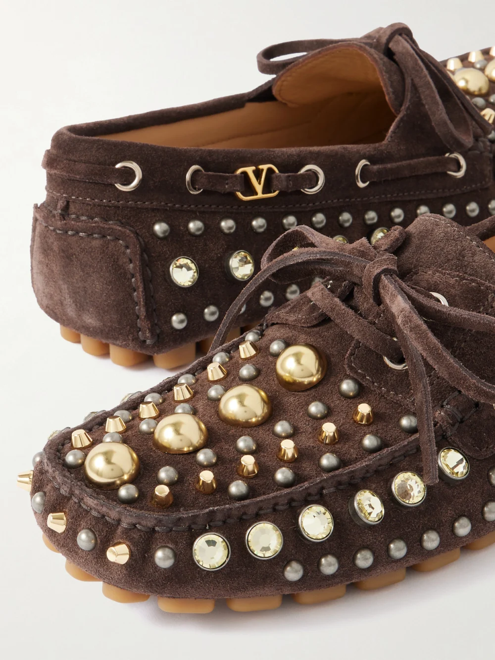 Close-up detail of the Valentino Garavani Fastaway Embellished Suede Loafers