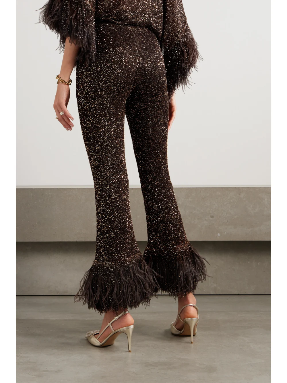 Back view of the Valentino Garavani Feather-trimmed Sequin-embellished Knitted Flared Pants