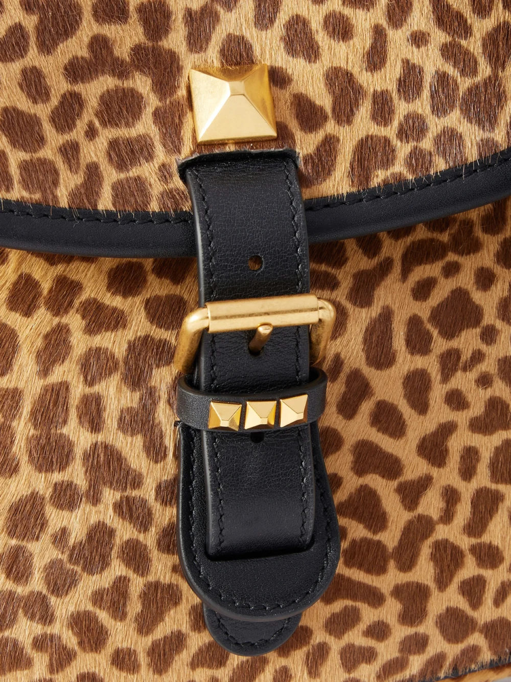 Close-up detail of the Valentino Garavani Flaneuse Small Studded Leather-trimmed Leopard-print Calf Hair Shoulder Bag