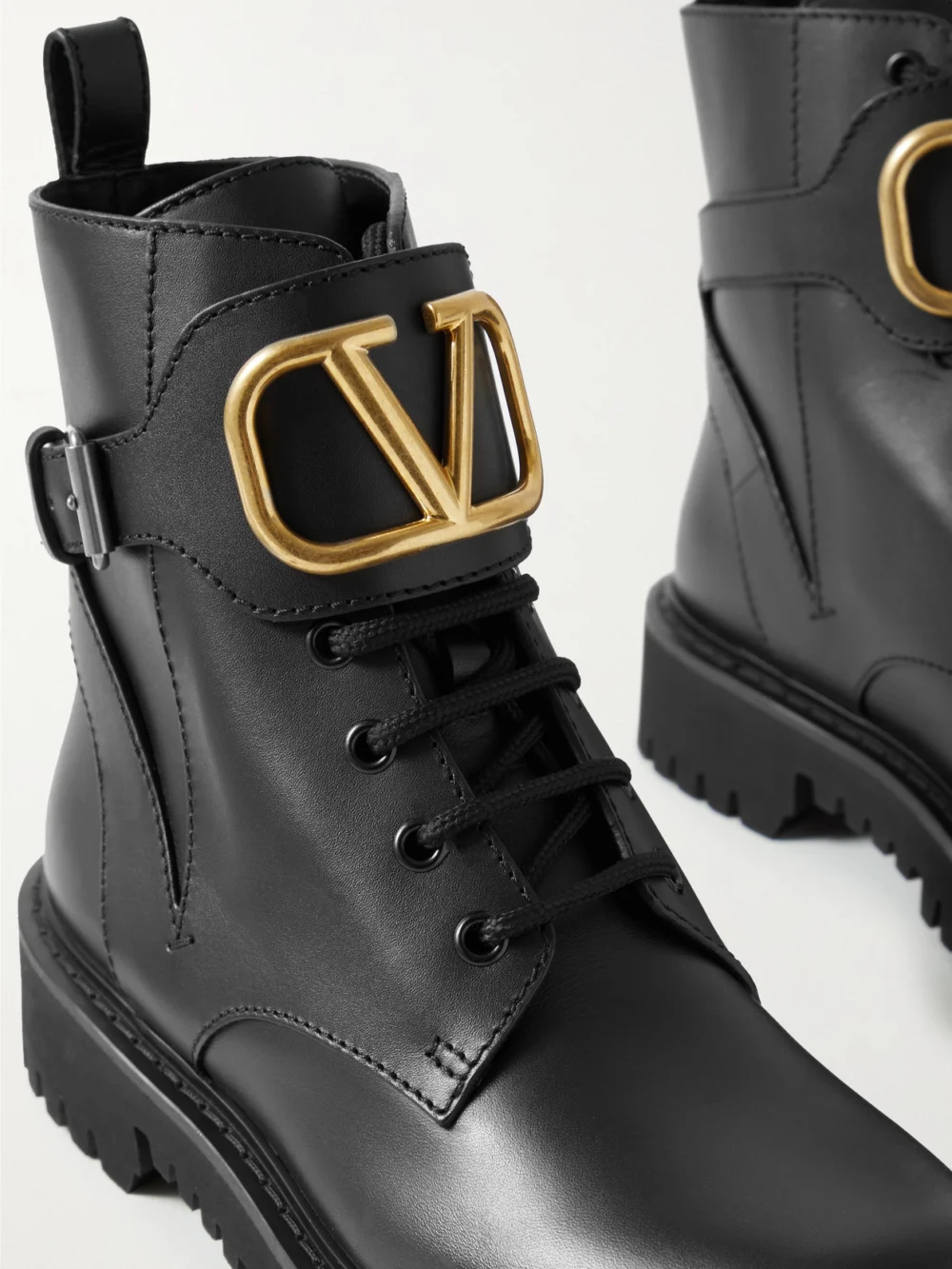 Close-up detail of the Valentino Garavani Go Logo Embellished Leather Ankle Boots