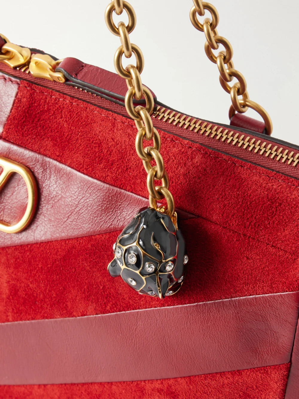 Close-up detail of the Valentino Garavani Growl Medium Embellished Leather Shoulder Bag