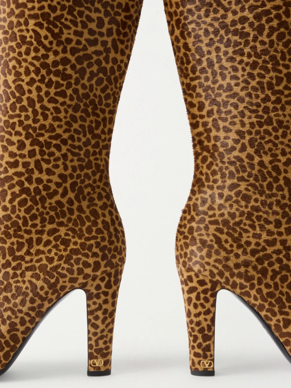 Close-up detail of the Valentino Garavani Hotty 100 Leopard-print Calf Hair Knee Boots