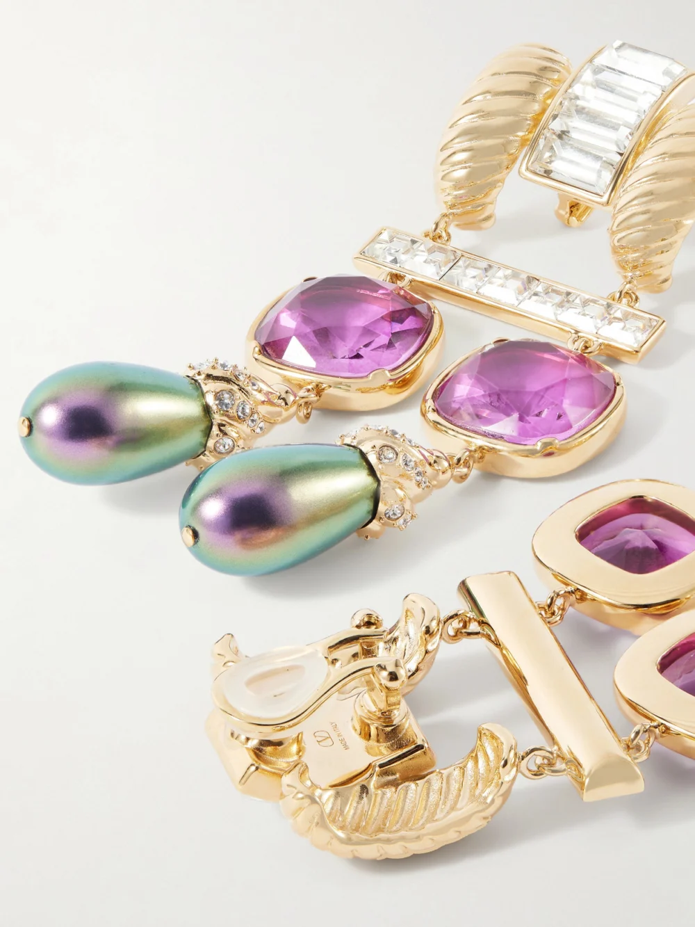 Close-up detail of the Valentino Garavani Hypergoutte Gold-tone, Crystal and Resin Earrings