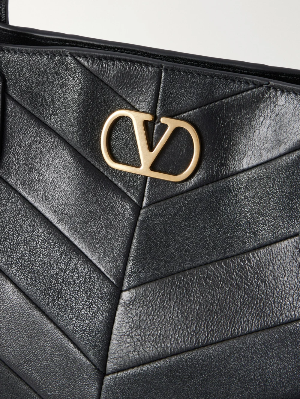 Close-up detail of the Valentino Garavani Jean Medium Chevron Leather Tote