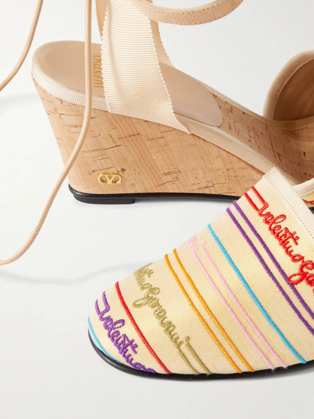 Close-up detail of the Valentino Garavani La Cruisette 75 Tasseled Embroidered Canvas Wedge Sandals