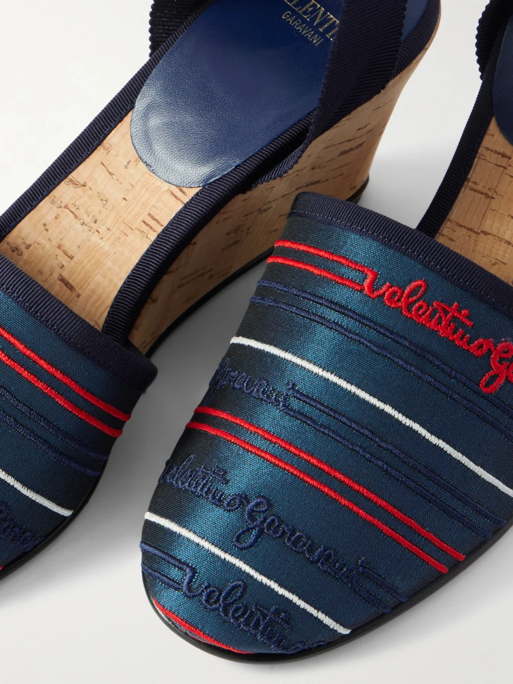 Close-up detail of the Valentino Garavani La Cruisette 75 Tasseled Embroidered Canvas Wedge Sandals
