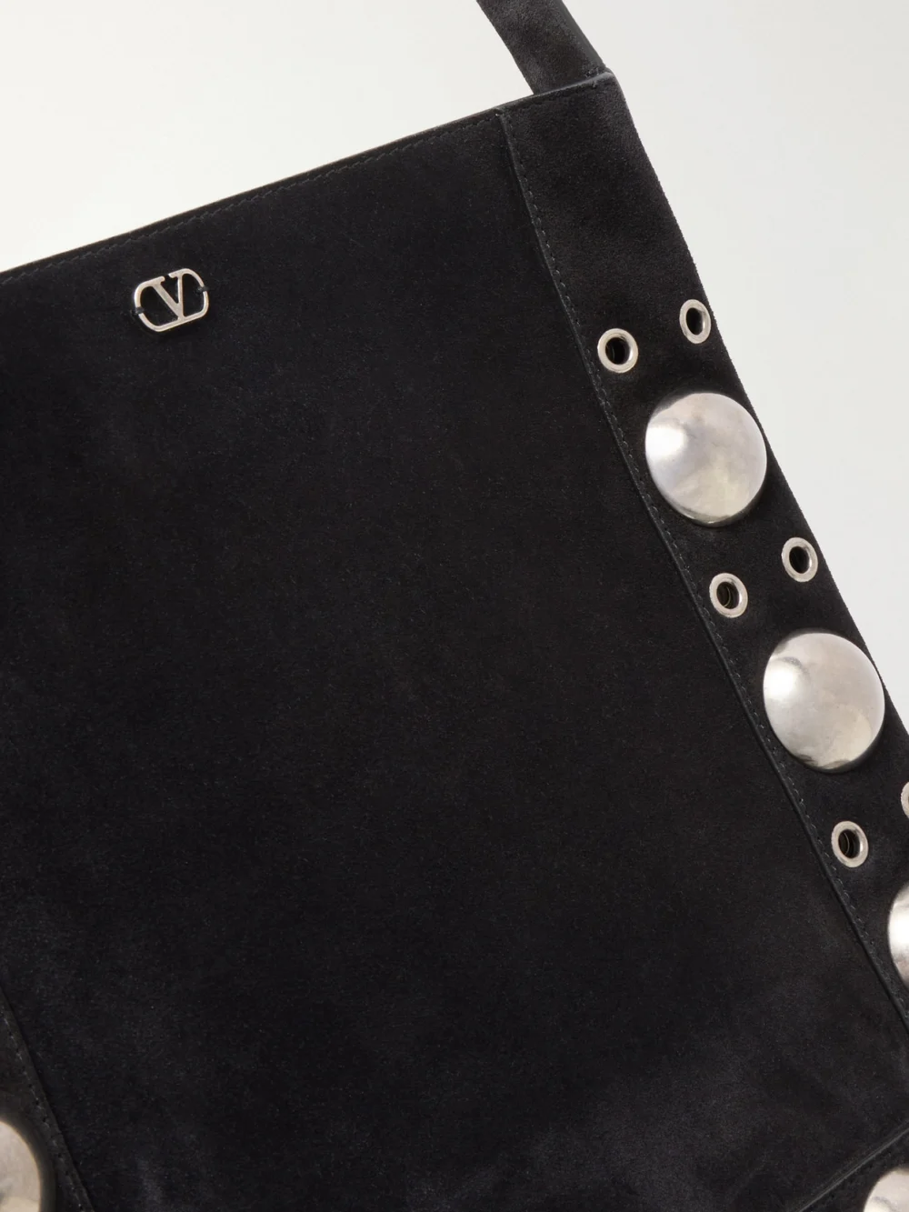 Close-up detail of the Valentino Garavani Nellcote Medium Fringed Studded Suede Shoulder Bag