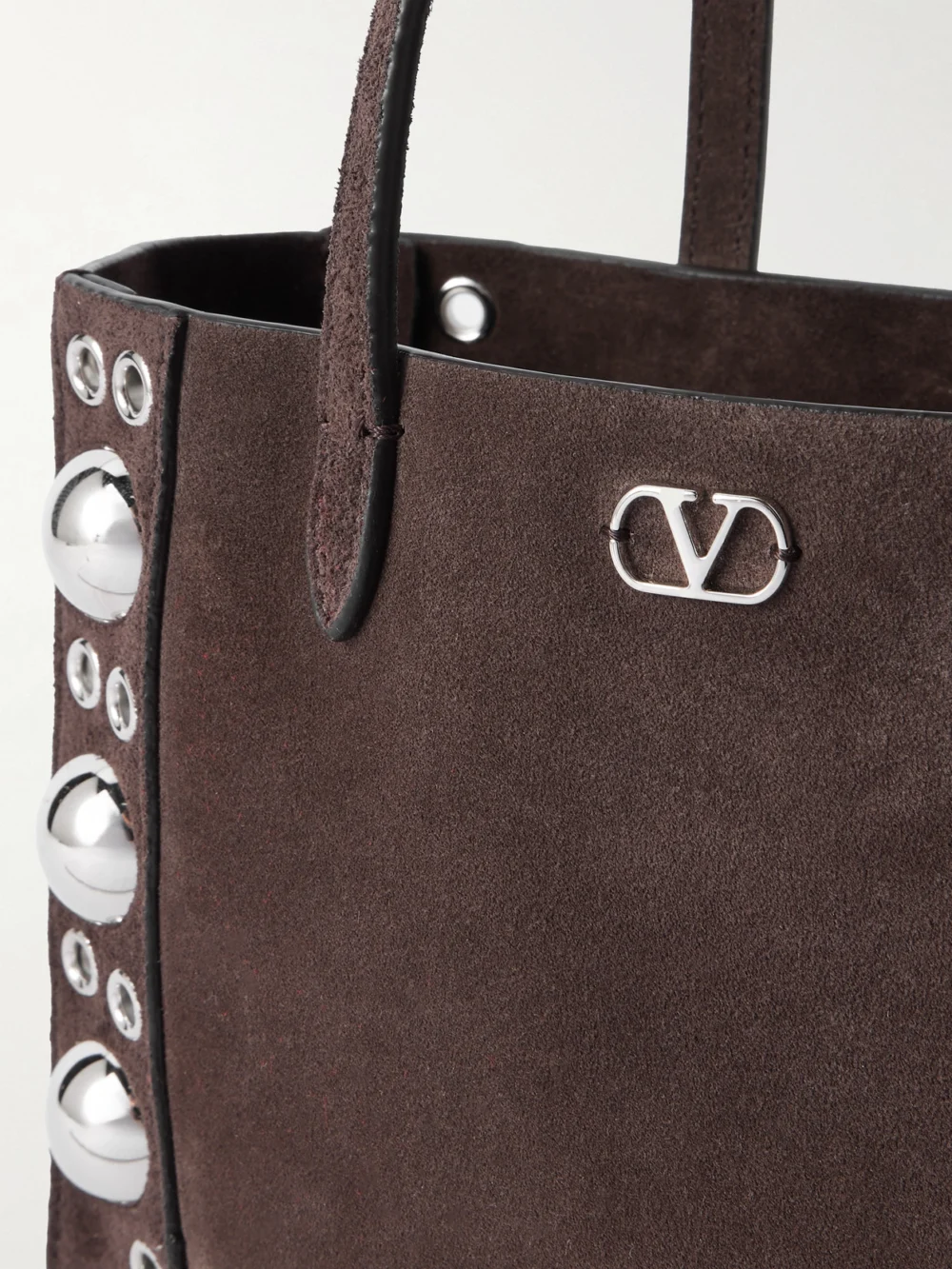 Close-up detail of the Valentino Garavani Nellcôte Mini Embellished Suede Tote