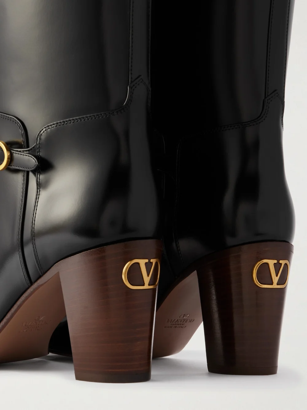 Close-up detail of the Valentino Garavani Pattie 75 Buckle-embellished Leather Boots