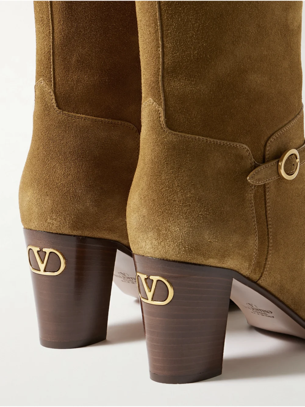 Close-up detail of the Valentino Garavani Pattie 75 Buckle-embellished Suede Knee Boots