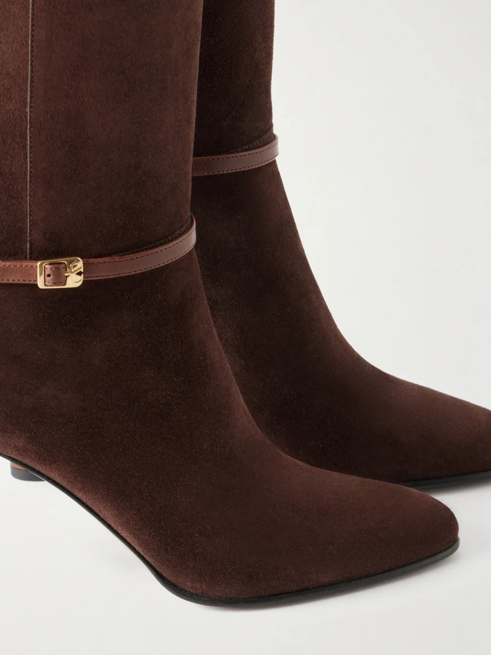 Close-up detail of the Valentino Garavani Pattie 85 Buckle-detail Suede Knee Boots