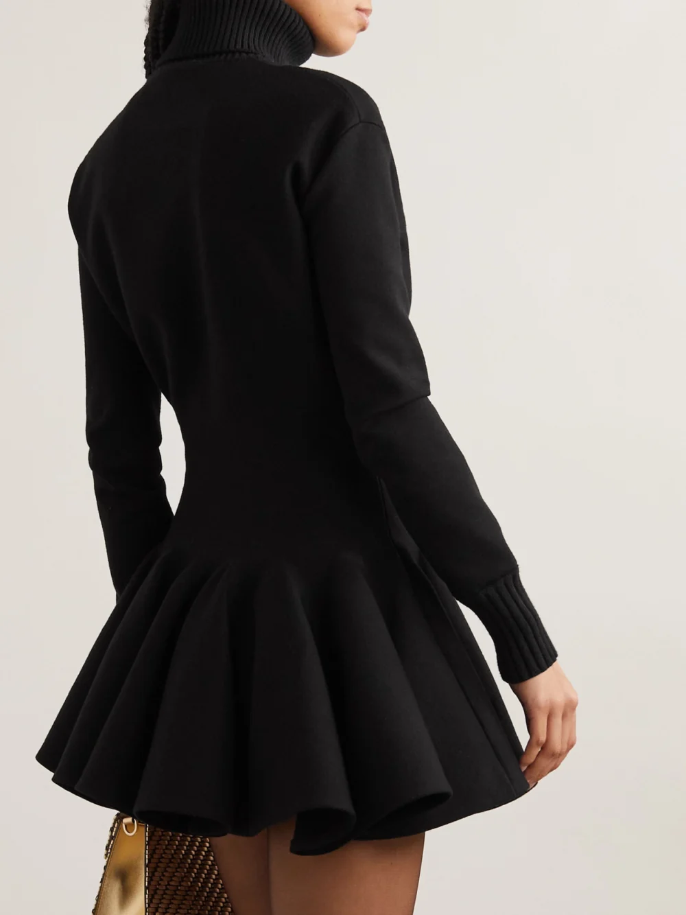 Back view of the Valentino Garavani Pleated Knitted Wool-blend Turtleneck Mini Dress