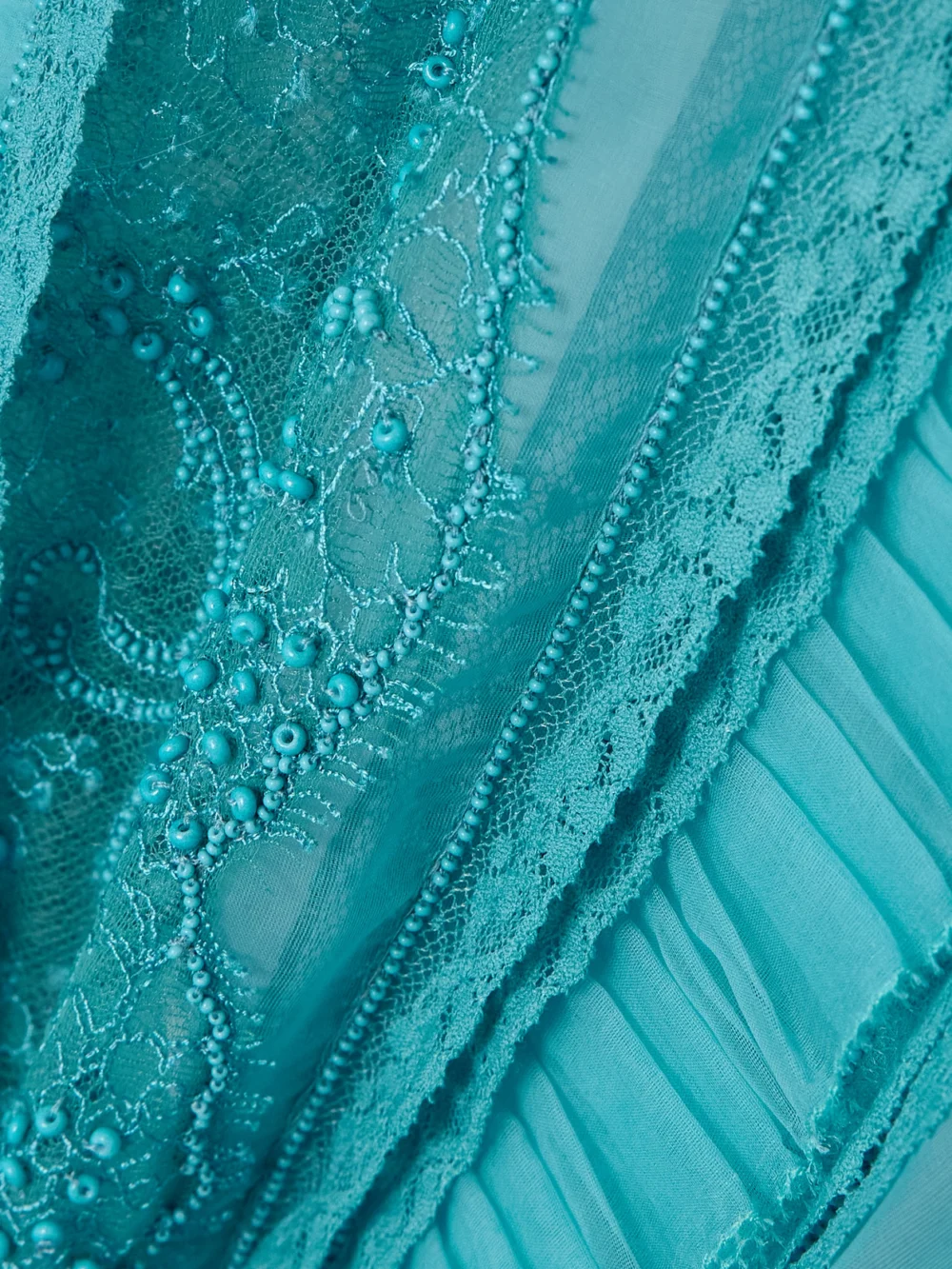 Close-up detail of the Valentino Garavani Pleated Ruffled Bead-embellished Lace-trimmed Silk-organza Shirt