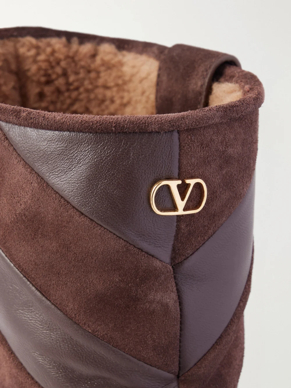 Close-up detail of the Valentino Garavani Rayons 40 Leather-trimmed Suede Ankle Boots