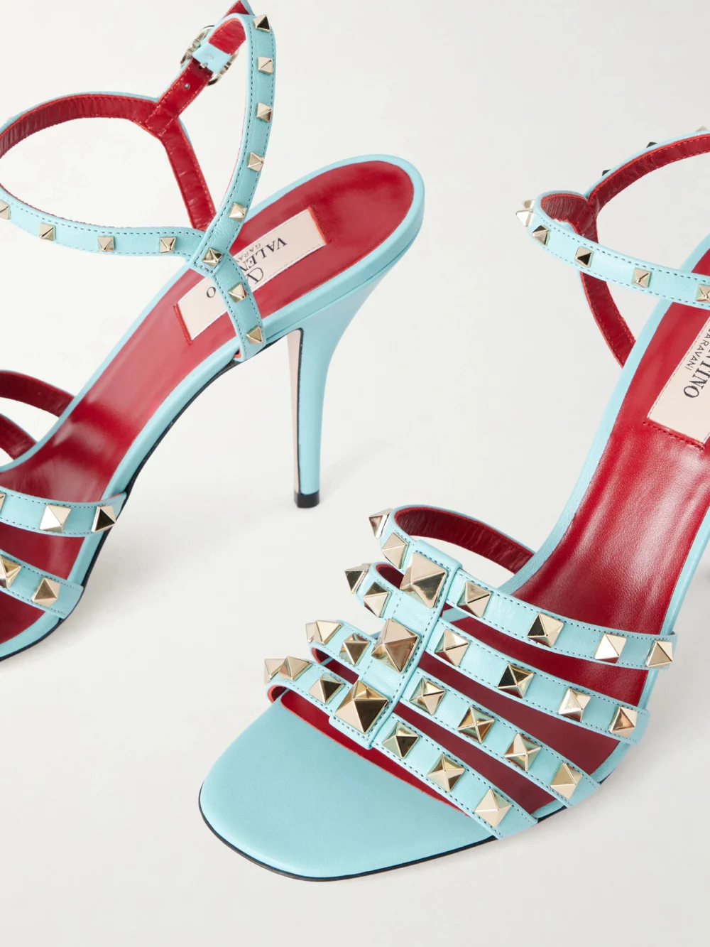 Close-up detail of the Valentino Garavani Rockstud 100 Embellished Leather Sandals