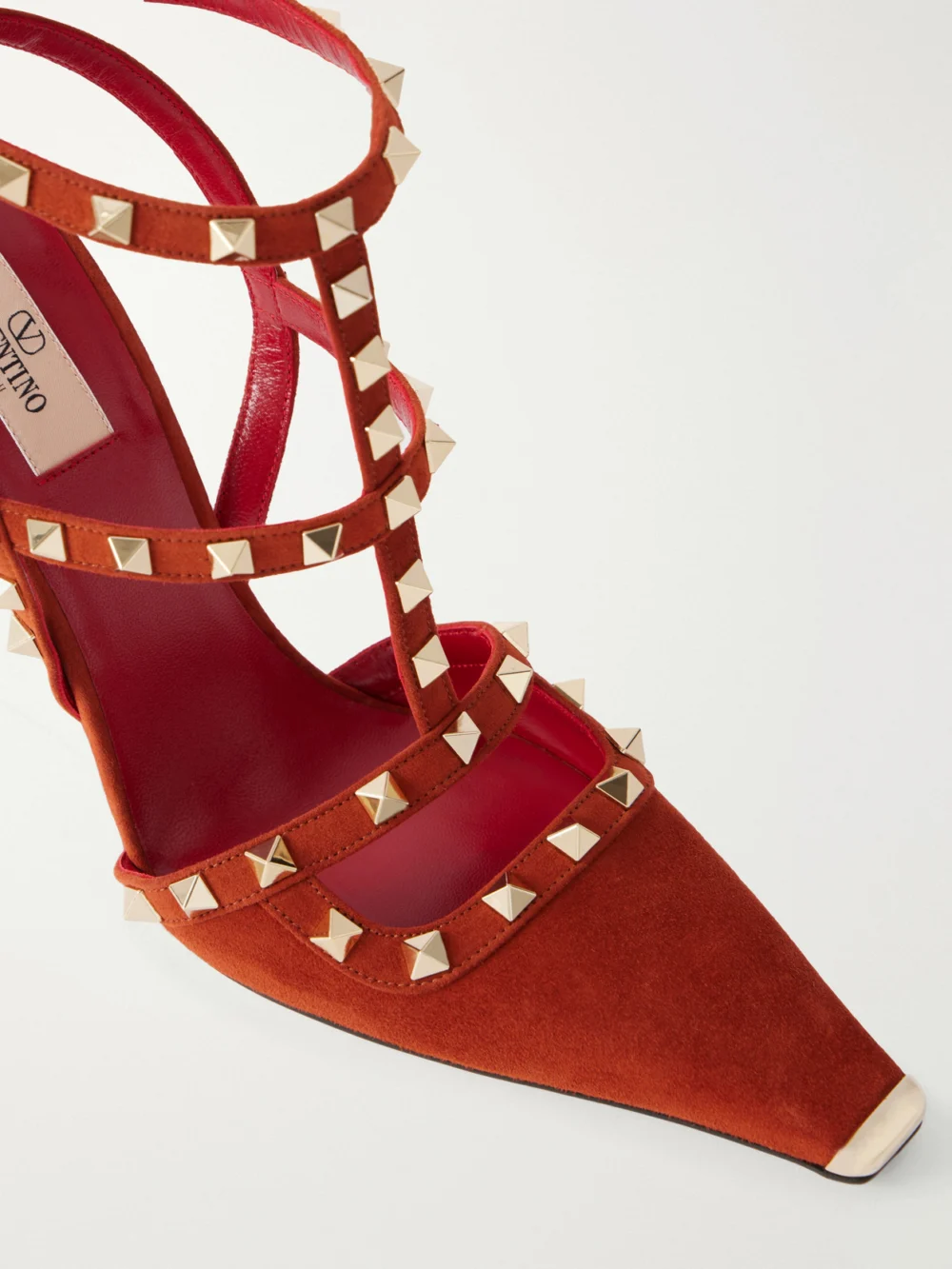 Close-up detail of the Valentino Garavani Rockstud 100 Embellished Suede Pumps