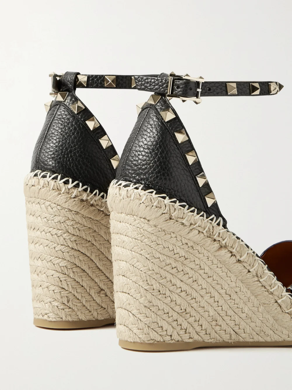 Close-up detail of the Valentino Garavani Rockstud 105 Textured-leather Espadrille Wedge Sandals