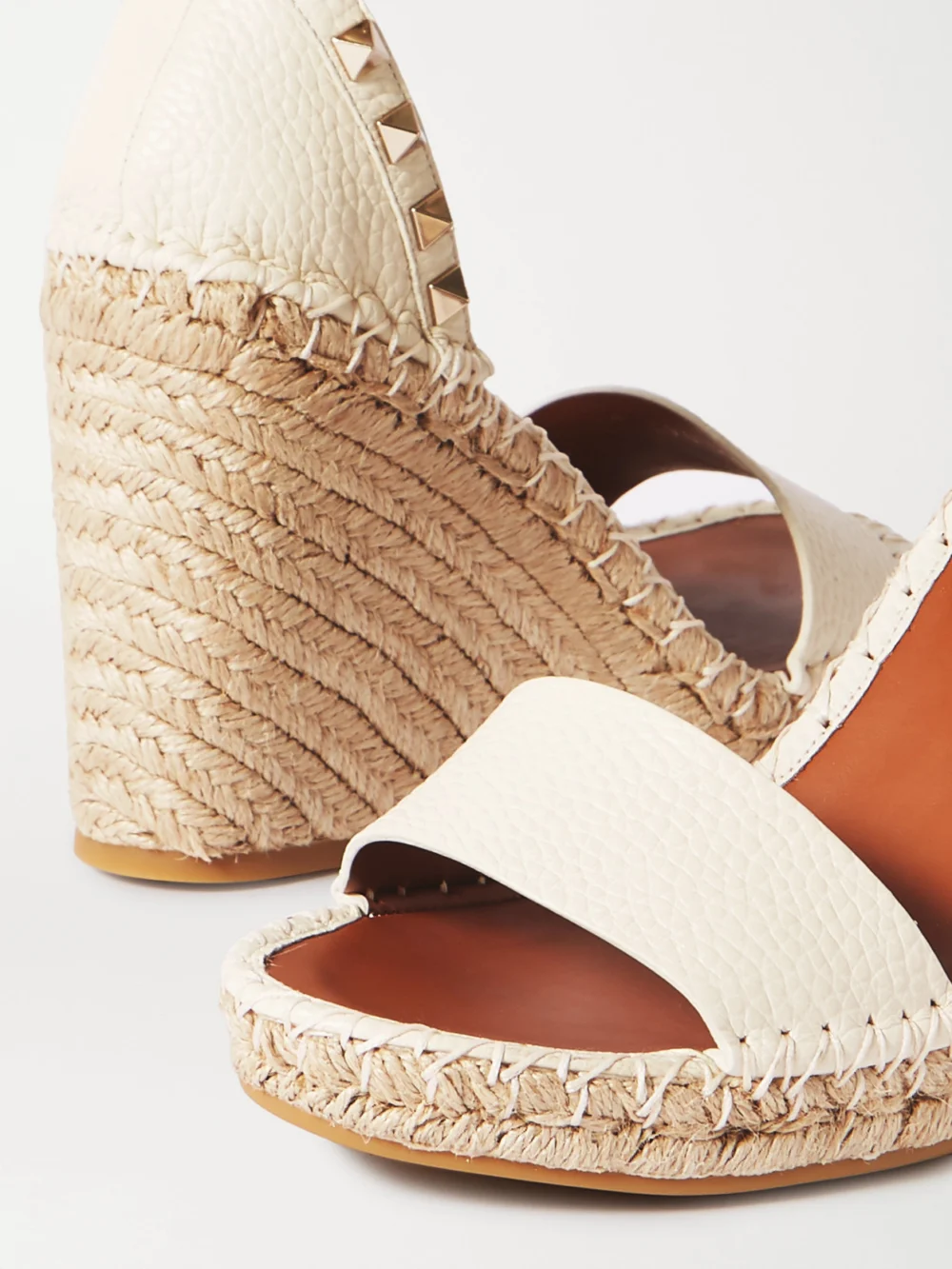 Close-up detail of the Valentino Garavani Rockstud 105 Textured-leather Espadrille Wedge Sandals