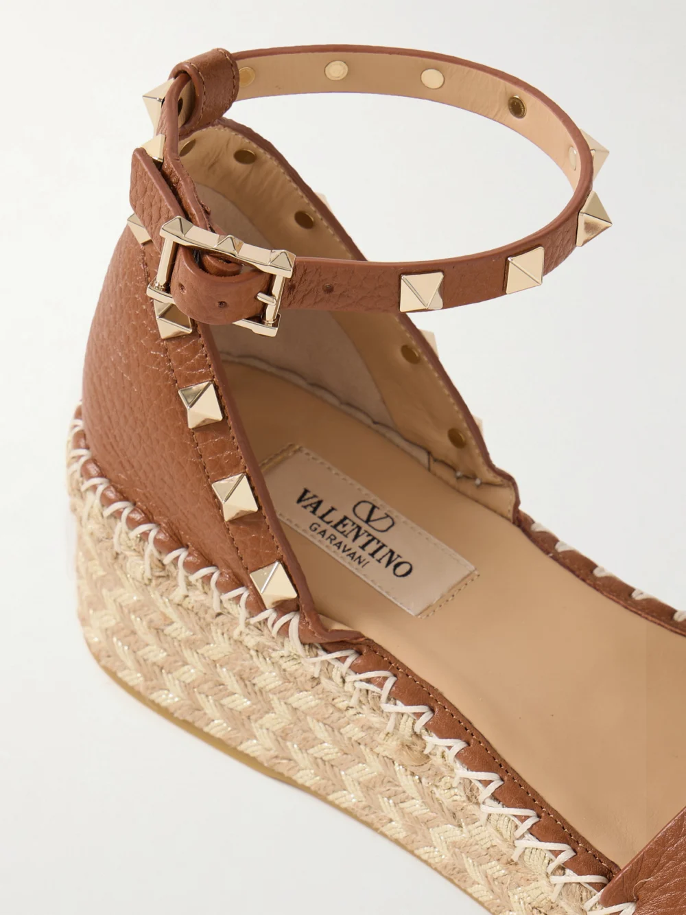 Close-up detail of the Valentino Garavani Rockstud 55 Textured-leather Espadrille Wedge Sandals