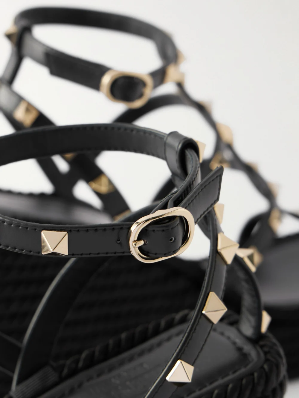Close-up detail of the Valentino Garavani Rockstud 95 Leather Wedge Sandals