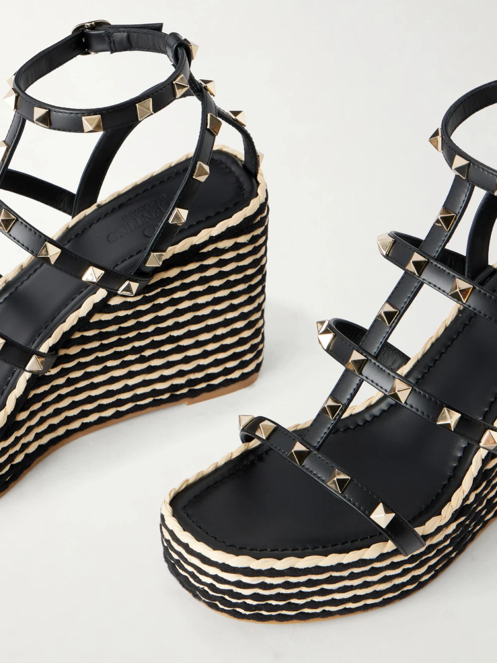 Close-up detail of the Valentino Garavani Rockstud Embellished Leather Wedge Espadrilles