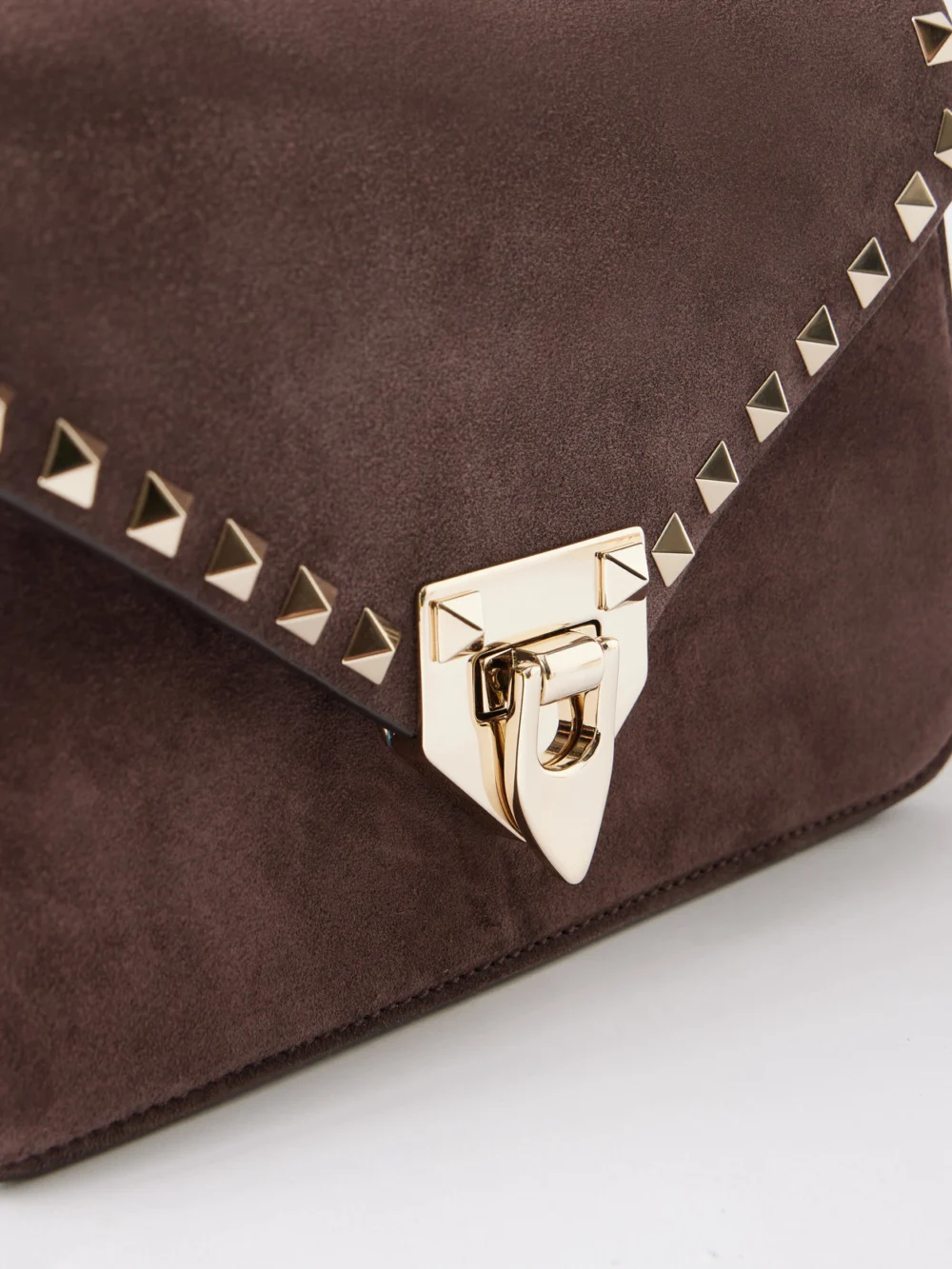 Close-up detail of the Valentino Garavani Rockstud Embellished Suede Shoulder Bag