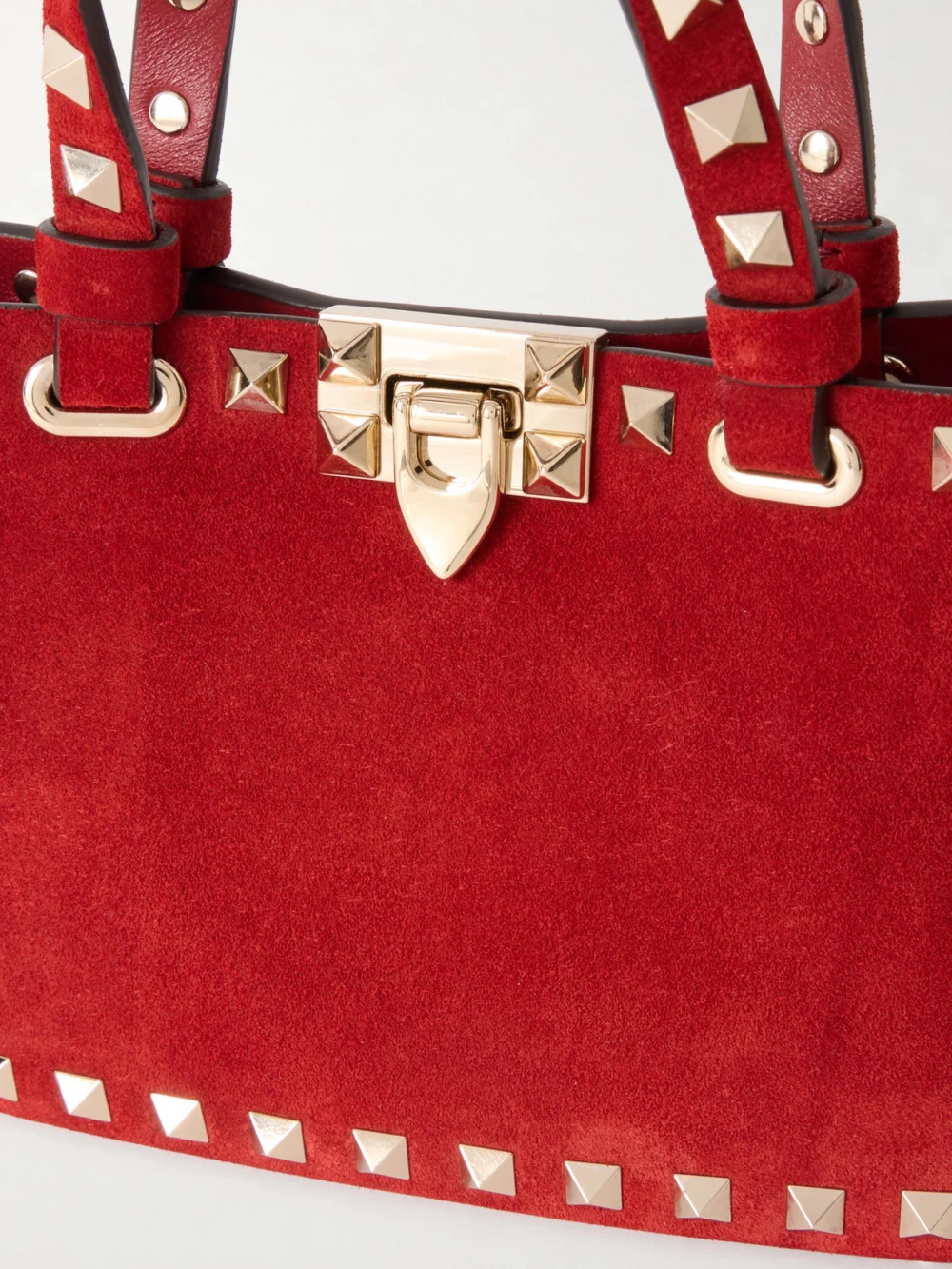 Close-up detail of the Valentino Garavani Rockstud Mini Embellished Suede Tote