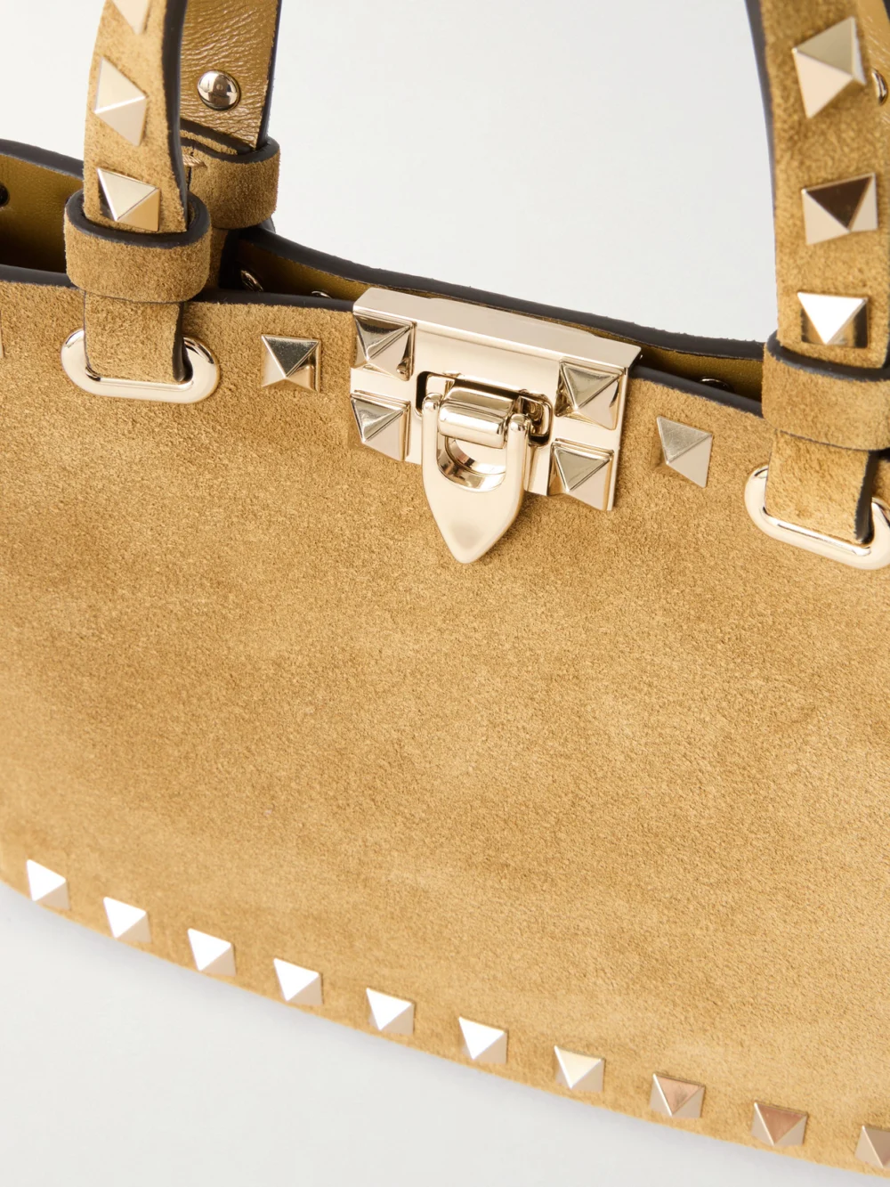 Close-up detail of the Valentino Garavani Rockstud Mini Embellished Suede Tote