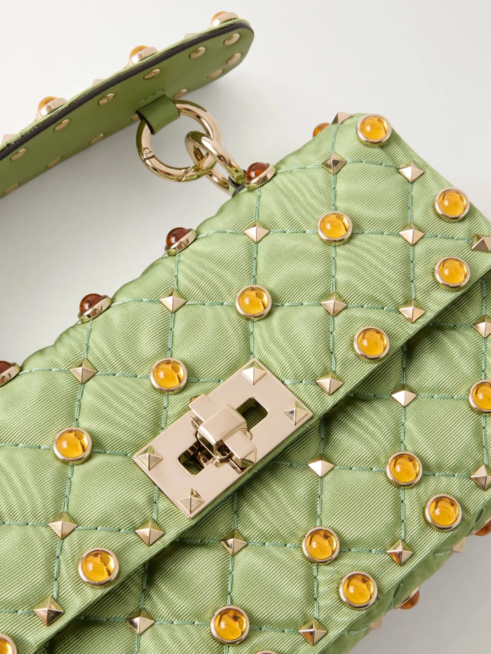 Close-up detail of the Valentino Garavani Rockstud Spike Studded Bead-embellished Quilted Moire Top-handle Bag